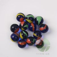Children's toy marbles in a black mesh bag